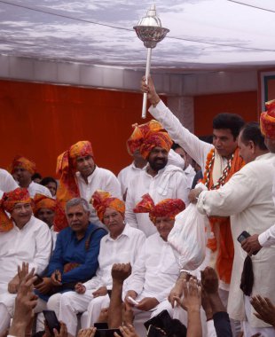 NEW DELHI, INDIA - MAY 5, 2024: DPCC Interim Chief Devendra Yadav with party leader Ajay Maken and others as he takes charge as the president of Delhi Congress, at the party office. clipart