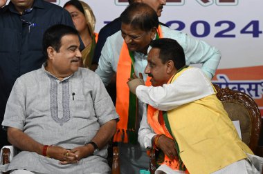 NEW DELHI, INDIA - MAY 8, 2024: Union Minister Nitin Gadkari along with BJP candidate from Chandni Chowk Praveen Khandelwal and BJP leaders during election campaign public meeting at Shastri Nagar on May 8, 2004 in New Delhi, India. clipart