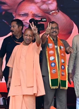 Uttar Pradesh Chief Minister Yogi Adityanath addresses a public meeting in support of Mahayuti Mumbai North Central candidate Ujjwal Nikam at Kurla, on May 18, 2024 in Mumbai, India.  clipart