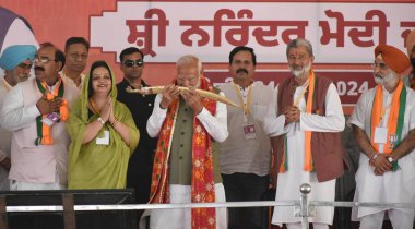 GURDASPUR, INDIA - MAY 24: Prime Minister Narendra Modi being honored during election campaign rally at Dina Nagar on May 24, 2024 in Gurdaspur, India.  clipart