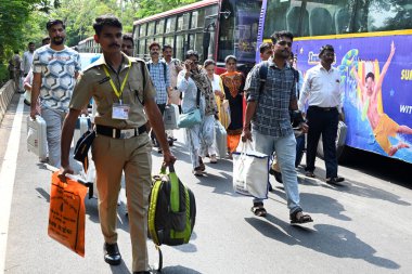 NAVI MUMBAI, INDIA - MAY 18, 2024: Election officials carry a (EVM) ballot box for distribution for constituency election scheduled on 20th May 2024 at Agri Koli Bhavan Nerul, on May 18, 2024 in Navi Mumbai, India. clipart