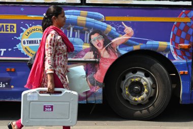 NAVI MUMBAI, INDIA - MAY 18, 2024: Election officials carry a (EVM) ballot box for distribution for constituency election scheduled on 20th May 2024 at Agri Koli Bhavan Nerul, on May 18, 2024 in Navi Mumbai, India. clipart