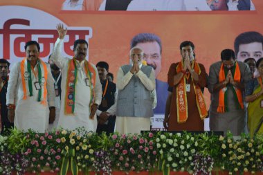 KALYAN, INDIA - MAY 15, 2024: Prime Minister Narendra Modi is seen addressing the campaign meeting of Shiv Sena and BJP Kalyan and bhiwandi Lok Sabha candidates Shrikant shinde ( Shiv Sena Shinde camp kalyan ) and kapil pati (BJP bhiwandi )  clipart