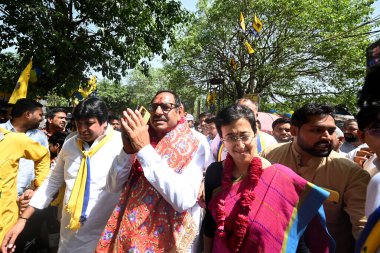 NEW DELHI, INDIA - APRIL 30: AAPs candidate from South Delhi for upcoming Lok Sabha Elections, Sahiram Pehalwan along with Delhi minister and AAP leader Atishi seen during a Roadshow before filing the Nomination Papers for the Elections at Okhla  clipart