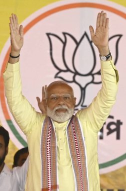 BARRACKPORE, INDIA - MAY 12, 2024: Prime Minister Narendra Modi gestures at a gathering during a election campaign rally in support of BJP candidate ahead of 4th phase of Lok Sabha Election 2024 at Jagatdal, on May 12, 2024 in Barrackpore, India clipart