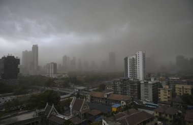 MUMBAI, INDIA - MAY 13, 2024: Dust Storm due to storm winds over city skyline of Prabhadevi, Parel on May 13, 2024 in Mumbai, India. Heavy winds, lightning, and rain lashed Mumbai and nearby regions of Thane and Palghar.  clipart