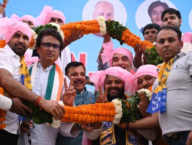 NEW DELHI, INDIA - MAY 23, 2024:  India alliance joint Lok Sabha Candidate Kuldeep Kumar during the Maha Panchayat along with Senior AAP and Congress Leaders Gopal Rai, Sanjay Singh, Former DPCC President Anil Choudhary at Ghazipur village clipart