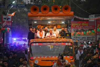 NEW DELHI, INDIA - MAY 21: Rajnath Singh, Union Minister for the Ministry of Defence conducts a roadshow as a part of Election campaign for the BJP Candidate from North West Delhi Constituency, Yogender Chandolia for upcoming Loksabha Elections 2024  clipart