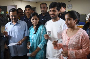 NEW DELHI, INDIA - MAY 25, 2024: Delhi Chief Minister Arvind Kejriwal along with his wife Sunita Kejriwal, father Gobind Ram Kejriwal, and children arrive to cast their votes for Lok Sabha election 2024, at polling station, at Civil Line area clipart