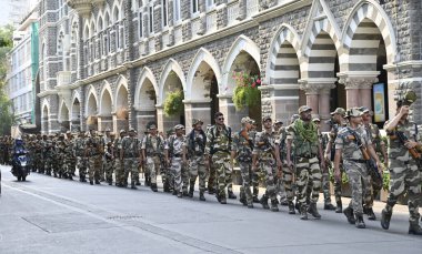 MUMBAI, INDIA - MAY 18, 2024: Mumbai Police personnel of COlaba Police station along with BSF,CISF, CRF, MSB and Homegaurd held a Route March in their jurisdiction, ahead of upcoming Lok Sabha election 2024, at Gateway Of India, on May 18, 2024 clipart