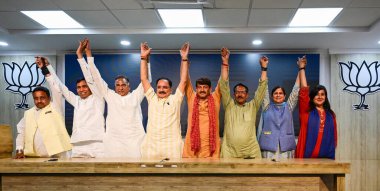 NEW DELHI, INDIA - MAY 24, 2024: Delhi BJP president Virendra Sachdeva with Lok Sabha BJP Candidates from Delhi (L-R) Praveen Khandelwal, Yogendra Chandolia, Ramvir Singh Bidhuri, Manoj Tiwari, Harsh Malhotra, Kamaljeet Sehrawat and Bansuri Swaraj. clipart