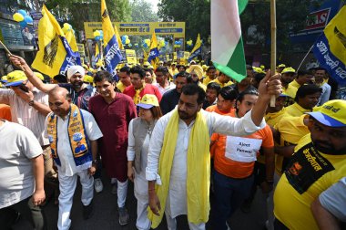 NEW DELHI, INDIA - MAY 5, 2024: Supporters during AAP (Aam Aadmi Party) Rajya Sabha MP Sanjay Singh, Delhi President Gopal Rai, Saurabh Bharadwaj, Lok Sabha Candidate Somnath Bharti, Mayor Shelly Oberoi participate in Walkathon event  clipart