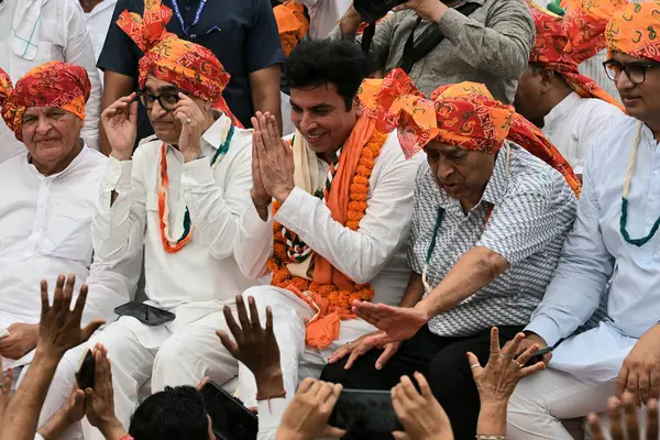 stock image NEW DELHI, INDIA - MAY 5, 2024: DPCC Interim Chief Devendra Yadav with party leader Ajay Maken and others as he takes charge as the president of Delhi Congress, at the party office.