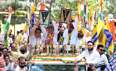 MOHALI, INDIA - MAY 14: India Alliance Chandigarh Candidate Manish Tewari with Chandigarh Congress President HS Lucky, AAP Chandigarh InCharge Sunny Singh Ahluwalia with supporters going to file nomination for Lok Sabha Election at sector 17  clipart