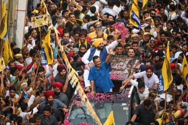 NEW DELHI, INDIA - MAY 11, 2024:  Folk dancer performing during the AAP Road show Campaign for upcoming Loksabha Elections, at Mehrauli area on May 11, 2024 in New Delhi, India clipart