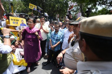 NEW DELHI, INDIA - MAY 19: Delhi Chief Minister Arvind Kejriwal, along with Rajya Sabha MPs Sanjay Singh, Raghav Chadha, Delhi ministers Suarabh Bhardwaj, Gopal Rai led a protest march towards BJP HQ against the arresting of AAP clipart