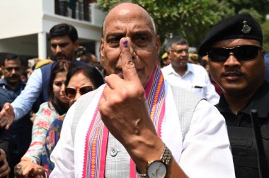 LUCKNOW, INDIA - MAY 20: Defence Minister of India and BJP Candidate from Lucknow Lok Sabha seat Rajnath Singh shows his inked fingers after casting his vote at Scholar home polling station Gomti Nagar during the fifth phase of Lok Sabha Election  clipart