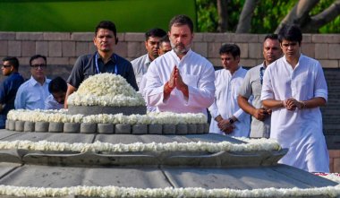 NEW DELHI, INDIA - MAY 21: Congress Leader Rahul Gandhi with Raihan Vadra paying tribute to former Prime Minister Rajiv Gandhi, during the Ceremony of Remembrance to mark the 33rd Anniversary of the Martyrdom of Rajiv Gandhi at Vir Bhumi, Rajghat on  clipart