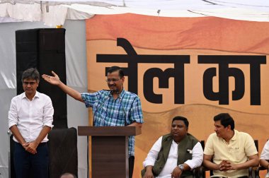 NEW DELHI, INDIA - MAY 19: Delhi Chief Minister Arvind Kejriwal, along with Rajya Sabha MPs Sanjay Singh, Raghav Chadha, Delhi ministers Suarabh Bhardwaj, Gopal Rai during a protest march towards BJP HQ against the arresting of AAP (Aam Aadmi Party)  clipart