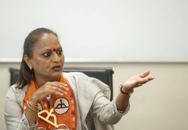 MUMBAI, INDIA - MAY 14, 2024: Yamini Jadhav, the Shiv Sena candidate from Mumbai South Lok Sabha constituency interacts with journalists at HT Office on May 14, 2024 in Mumbai, India  clipart