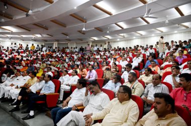 GREATER NOIDA, INDIA - APRIL 3: People listening to Uttar Pradesh Deputy Chief Minister Brajesh Pathak during a meeting for campaigning for BJP Candidate from Gautam Budh Nagar Parliamentary Constituency Mahesh Sharma at Sharda University  clipart