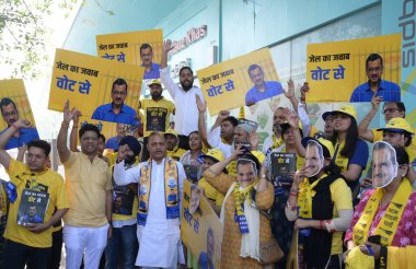 Delhi Cabinet Minister Saurabh Bharadwaj and AAP candidate for New Delhi Lok Sabha seat Somnath Bharti distribute pamphlets at Hauz Khas Metro Station Gate No 1 on April 25, 2024 in New Delhi, India. clipart