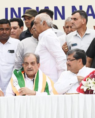 NEW DELHI, INDIA - APRIL 9, 2024: Former union minister Birender Singh with Congress leaders Mukul Wasnik, Bhupinder Hooda and Selja Kumari as he joins Congress, at AICC headquarters in New Delhi, India, on Tuesday, April 9, 2024  clipart