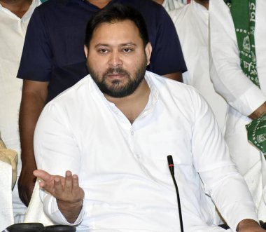 PATNA, INDIA - APRIL 21: RJD leader Tejashwi Yadav addressing a press conference during Milan Samaroh at RJD office on April 21, 2024 in Patna, India.  clipart