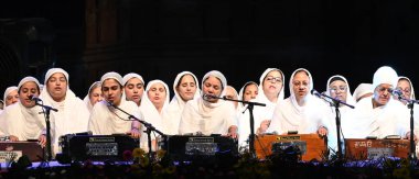 NEW DELHI, INDIA - APRIL 27, 2024: Sikh Women Kirtan - Group Women Satsang Sabha Delhi during the Delhi Fateh Diwas,(Delhi Victory Day) commemorating 400th birth anniversary of Mata Gujri Ji,organized by the Delhi Sikh Gurdwara Management Committee clipart