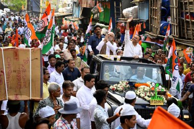 Roadshow campaign in support of MP and TMC candidate for Kolkata North Parliamentary constituency Sudip Bandyopadhyay (L) along with TMC MLA Vivek Gupta (R) at Burrabazar area on April 2, 2024 in Kolkata, India. clipart