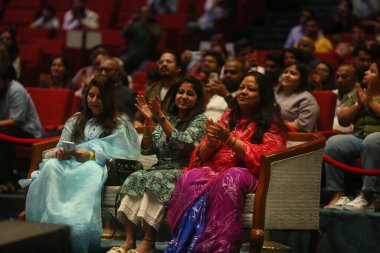 NEW DELHI, INDIA - MARCH 17, 2024: Crowd enjoying the session of Bollywood singer Mohit Chauhan with lyricist Gulzar during the 17th Kathakar International Storytellers Festival at Delhis Bharat Mandapam, Pragati Maidan, on March 17, 2024 clipart