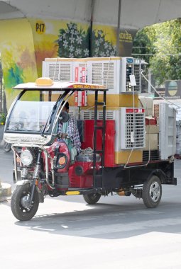 NOIDA, INDIA - APRIL 10, 2024: A man transports air coolers on a E-rickshaw as temperatures rise in sector 31, on April 10, 2024 in Noida, India. (Photo by Sunil Ghosh /Hindustan Times )  clipart