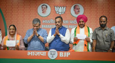 NEW DELHI, INDIA - APRIL 20: Karamjit Kaur Chaudhary, wife of Late Congress MP Santokh Chaudhary along with Ex Congress leader Tajinder Singh Bittu joins BJP in presence of BJP Leader Vinod Tawde and Union Minister Ashwini Vaishnaw at BJP Headquarter clipart