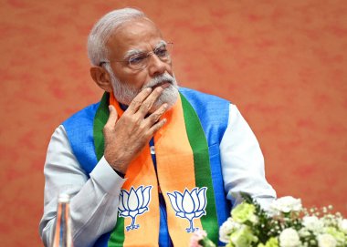 NEW DELHI, INDIA - APRIL 14, 2024: Prime Minister Narendra Modi during the launch of BJP's Sankalp Patra for Lok Sabha Elections 2024 at BJP HQ clipart