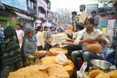 GURUGRAM, INDIA - APRIL 10: People shopping outside Jama Masjid on the eve of Eid-Ul-Fitr festival in Sadar Bazar near Sohna Chowk, on April 10, 2024 in Gurugram, India.  clipart