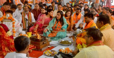 NEW DELHI, INDIA - APRIL 30, 2024: New Delhi BJP Candidate Bansuri Swaraj, along with Family member and BJP Offering Prayer and Hawan before start Road show filing the nomination for upcoming Lok Sabha election at Tughlak Lane. clipart