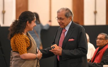 NEW DELHI, INDIA - APRIL 6, 2024: NK Singh, Chairman of 15th Finance commission of India during an award ceremony as he receives the TIOL Fiscal Heritage Award 2023 from former President of India, Ramnath Kovind at Taj Hotel Mansingh Road  clipart