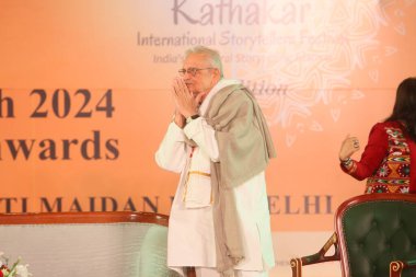 NEW DELHI, INDIA - MARCH 17, 2024: Bollywood lyricist Gulzar during the 17th Kathakar International Storytellers Festival at Delhis Bharat Mandapam, Pragati Maidan, on March 17, 2024 in New Delhi, India clipart