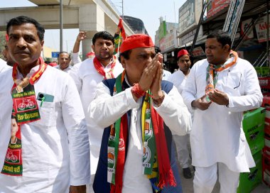 NOIDA, INDIA - APRIL 10: Samajwadi Party (SP) Candidate Dr. Mahendra Nagar (Center), and other SP worker doing door to door campaigning at Hoshiarpur Village in Sector 51, on April 10, 2024 in Noida, India.  clipart