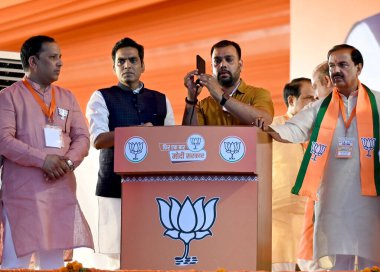 NEW DELHI, INDIA - APRIL 13: BJPs Gautam Buddh Nagar candidate Mahesh Sharma and other leaders during a campaign rally for the Lok Sabha elections addressed by the Home Minister Amit Shah in sector 33, on April 13, 2024 in New Delhi, India.  clipart