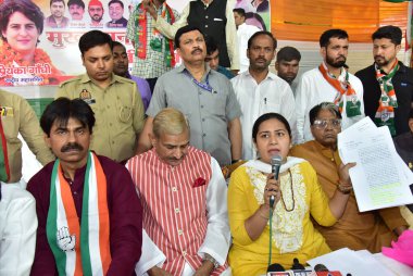 GHAZIABAD, INDIA - APRIL 5: Uttar Pradesh Congress President Ajay Rai and Ghaziabad Lok Sabha candidate Dolly Sharma during the inauguration of Congress Lok Sabha election campaign office  at Ambedkar Road on April 5, 2024 in Ghaziabad, India.  clipart