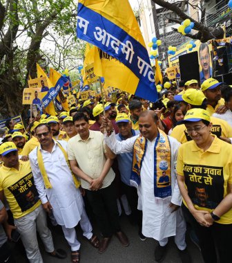 NEW DELHI, INDIA - APRIL 28, 2024: Delhi Cabinet ministers Saurabh Bhardwaj, Atishi and AAP Candidate from New Delhi Somnath Bharti and South Delhi Candidate Sahi Ram Pehalwan for Lok Sabha during a walkathon named 'Walk for Kejriwal'.  clipart