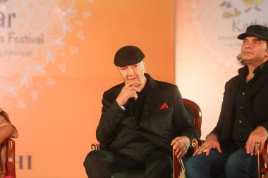 NEW DELHI, INDIA - MARCH 17, 2024: Bollywood actor Prem Chopra with singer Mohit Chauhan during the 17th Kathakar International Storytellers Festival at Delhis Bharat Mandapam, Pragati Maidan, on March 17, 2024 in New Delhi, India  clipart