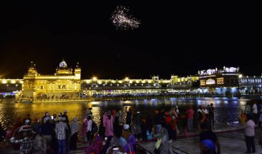 AMRITSAR, INDIA - APRIL 29:  Fireworks on the occasion of the birth anniversary of the ninth Sikh Guru Teg Bahadur at Golden Temple on April 29, 2024 in Amritsar, India clipart