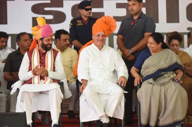 GURUGRAM, INDIA - APRIL 29, 2024: Chief Minister of Haryana, Nayab Singh Saini, Union Minister of State and BJP Gurugram parliamentary constituency candidate, Rao Inderjit Singh and Former MP Sudha Yadav during the nomination rally at Civil line  clipart