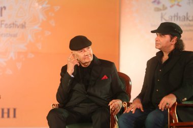 NEW DELHI, INDIA - MARCH 17, 2024: Bollywood actor Prem Chopra with singer Mohit Chauhan during the 17th Kathakar International Storytellers Festival at Delhis Bharat Mandapam, Pragati Maidan, on March 17, 2024 in New Delhi, India  clipart