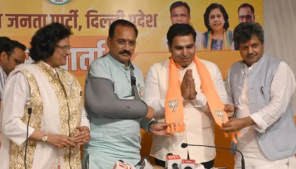 stock image NEW Delhi, INDIA - APRIL 16, 2024: Praveen Kumar son of Congress Leader Jai Kishan from West Delhi and Congress Leader Prateek Anand and other Congress Leaders joining BJP. 