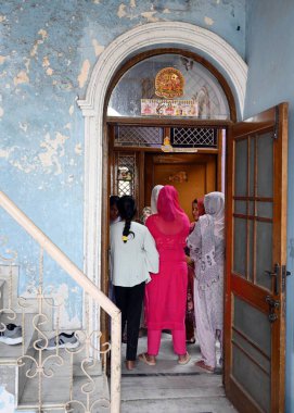 NEW DELHI, INDIA - APRIL 1, 2024: Family members explained the scene where Leopard entered in their house at Jagatpur Village near Wazirabad on April 1, 2024 in New Delhi, India.  clipart