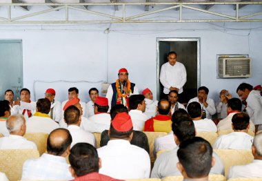 NOIDA, INDIA - APRIL 10: Samajwadi Party (SP) Candidate Dr. Mahendra Nagar, addressing gathering at Hoshiarpur Village in Sector 51, on April 10, 2024 in Noida, India.  clipart