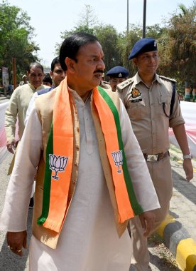 GREATER NOIDA, INDIA - APRIL 3: BJP Candidate from Gautam Budh Nagar parliamentary constituency Mahesh Sharma (Centre) filed his nomination at Surajpur Collector Office, on April 3, 2024 in Greater Noida, India.  clipart